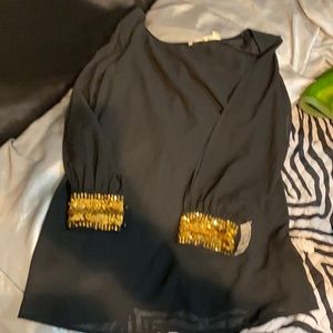 Black mini dress with golden cuffs